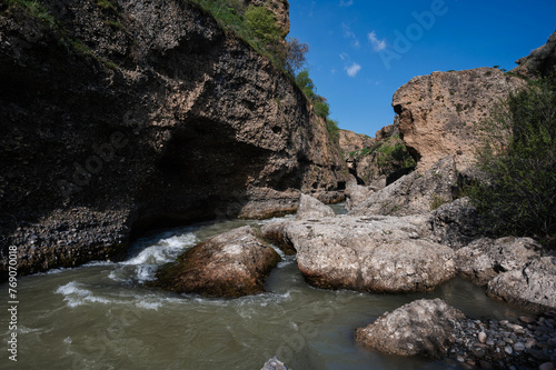 Aksu Canyon with a river in the mountains in Kazakhstan