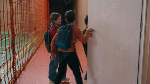 Wallpaper Mural Group of happy talking multiethnic diversity pupils diverse children talk walking in school corridor kids classmates go walk in hall come in classroom learning studying friendship talking laughing Torontodigital.ca