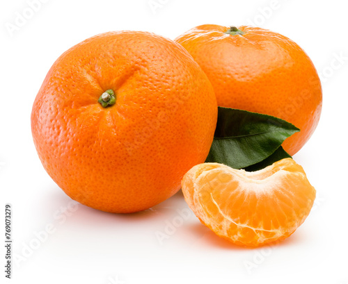 Two ripe tangerine with slices and green leaf isolated on white background