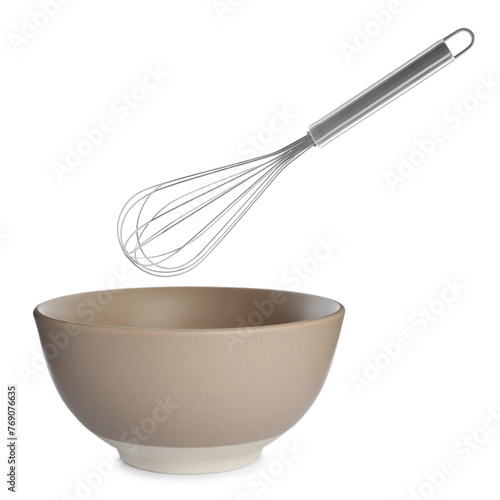 Metal whisk and ceramic bowl isolated on white. Cooking utensils