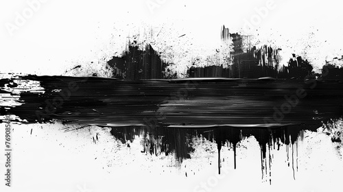 Black paint is smeared with strokes and splashes on a white background. photo