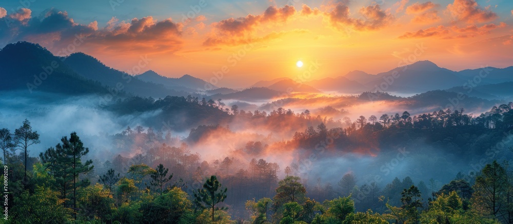 Obraz premium mountain layer in morning sun ray and winter