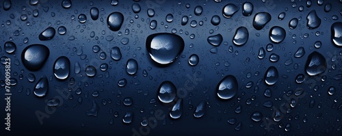 water droplets on all navy blue matte background with copy space and blank pattern for text or photo backgrdrop