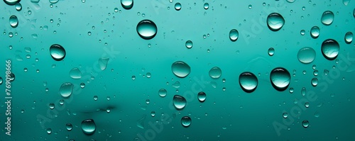 water droplets on all turquoise matte background with copy space and blank pattern for text or photo backgrdrop