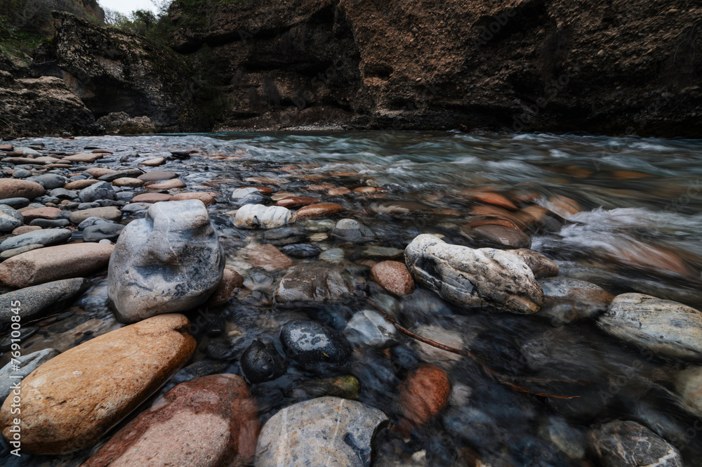 stones in a mountain river in the mountains in the Aksu canyon in Kazakhstan stones in a mountain river in the mountains in the Aksu canyon in Kazakhstan