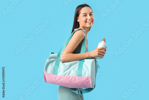 Sporty young woman with bag...