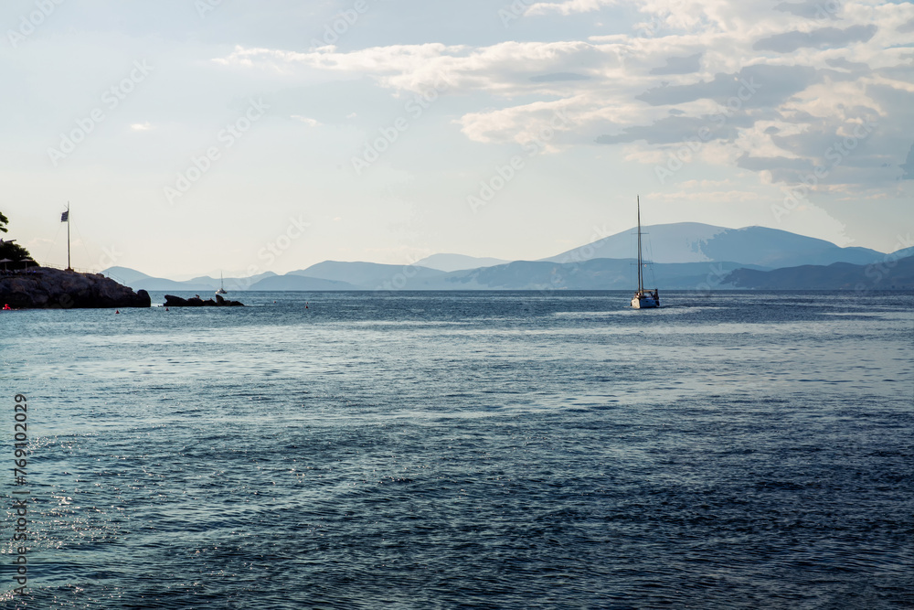 Motorboat swimming on  high speed in Mediterranean Sea - view from Hydra Greek island