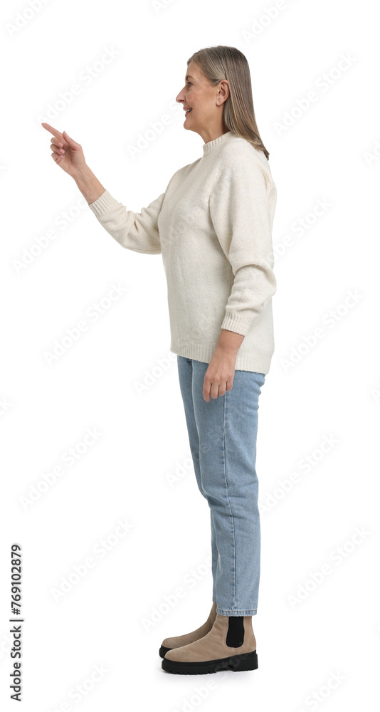 Senior woman pointing at something on white background Senior woman pointing at something on white background
