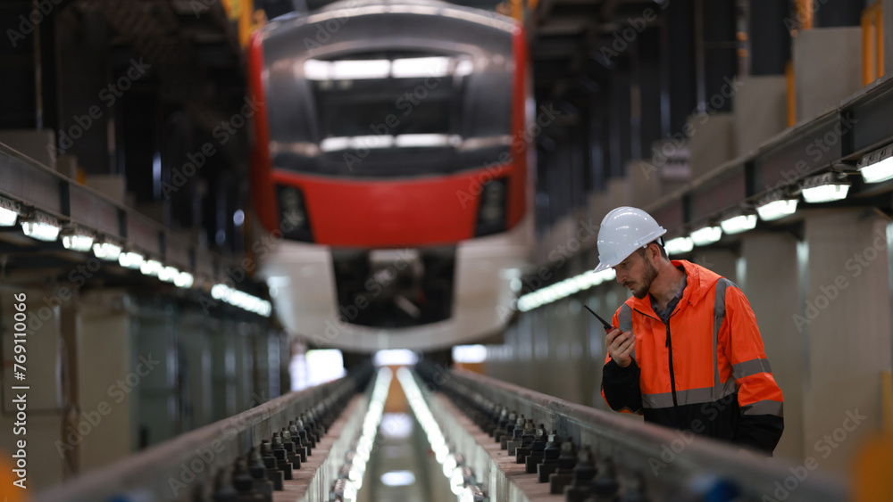 Observing the engineer working on the Electrical train tracks. Observing the engineer working on the Electrical train tracks.