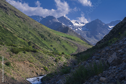 Tien Shan Mountains in the Koksai Gorge in the Aksu-Zhabagly Nature Reserve in Asia in Kazakhstan in summer under a blue sky photo