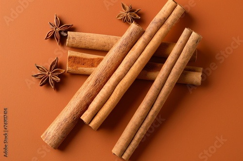 Cinnamon sticks and star anise on brown