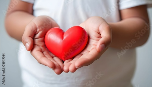 Child hands holding red heart  health care  donate and family insurance concept  world heart day  world health day created with generative ai.