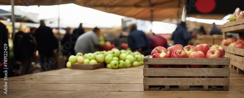 Wooden crate of apples on wooden counter background. Fresh fruits in farmers market or supermarket, wide format close up with copy space for text, horizontal format, fall or summer vibe