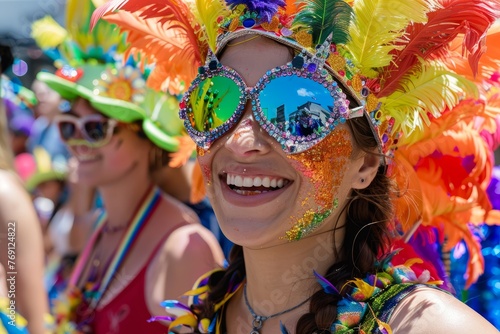 A woman in vibrant costume wears a colorful mask and feathers on her head