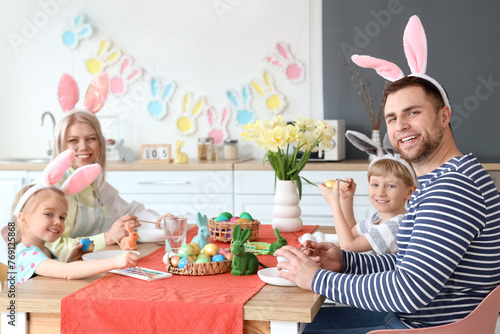 Happy family painting Easte...