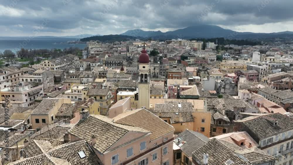 Panoramic view of Kerkyra, capital of Corfu island, Greece. Aerial drone view of Kerkyra with beautiful buildings during winter, cloudy day. Corfu island, Greece. Panoramic view of Kerkyra, capital of Corfu island, Greece. Aerial drone view of Kerkyra with beautiful buildings during winter, cloudy day. Corfu island, Greece.