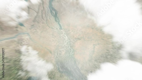 Earth zoom in from space to Ayorou, Niger. Followed by zoom out through clouds and atmosphere into space. Satellite view. Travel intro. Images from NASA photo