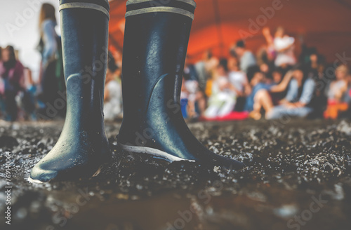 Rubber Boots In The Mud At A Music Festival