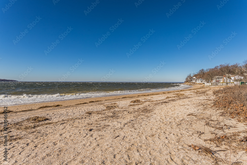 Rocky and Sandy Beach Shoreline with Ocean View with Clear Blue Sky