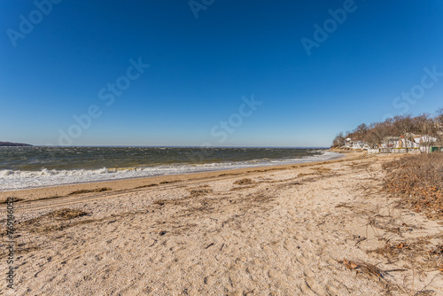 Rocky and Sandy Beach Shoreline with Ocean View with Clear Blue Sky