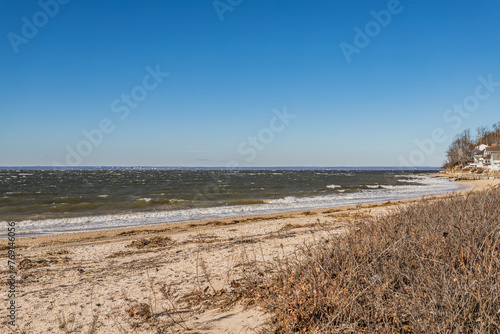 Rocky and Sandy Beach Shoreline with Ocean View with Clear Blue Sky