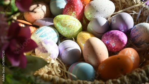 colorful Easter eggs in a wicker basket photo