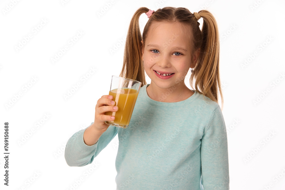 Cute little girl with glass of juice on white background Cute little girl with glass of juice on white background