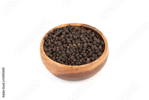 Wooden bowl full of pepper peas on white background. © svdolgov