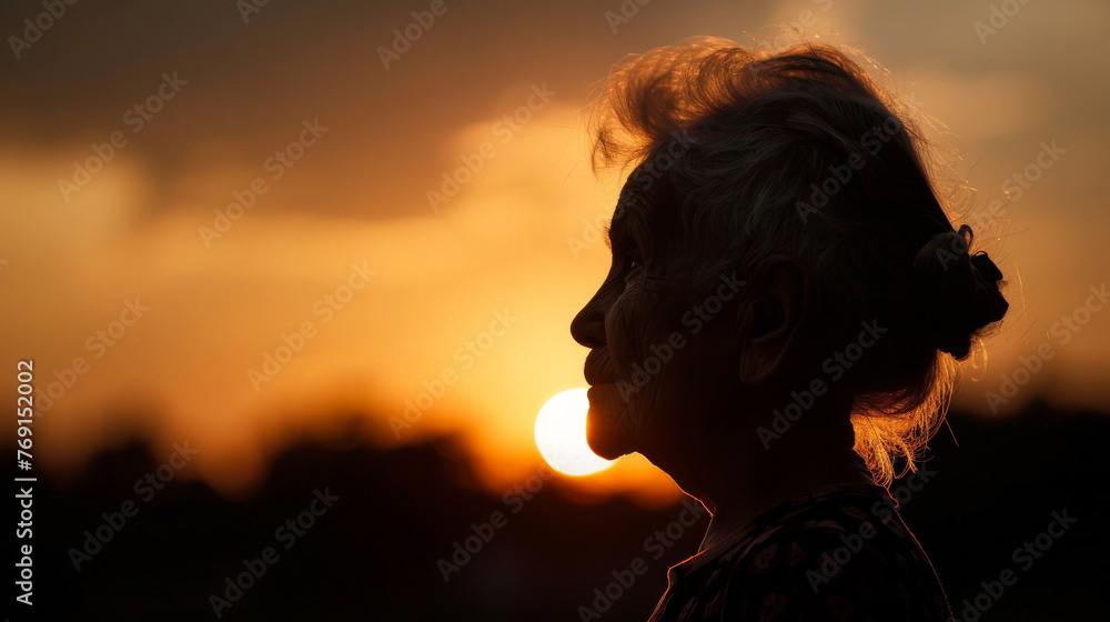 Silhouette of old woman's head at sunset symbolising memory loss, dementia, Alzheimer's Silhouette of old woman's head at sunset symbolising memory loss, dementia, Alzheimer's