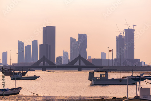 Boats and cityscpae view in the fisherman's bay in Manama Bahrain photo