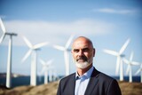 Businessman standing in front of wind turbine, ecology at work, clean energy. Generative AI.