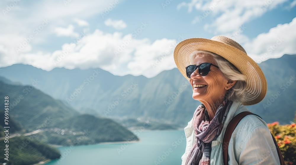 Elderly Female Traveler Enjoying Mountain Lake View