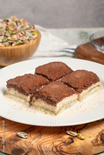 Dark chocolate and milk baklava. Cold baklava with chocolate on a wooden serving board. Famous dishes of Turkish cuisine
