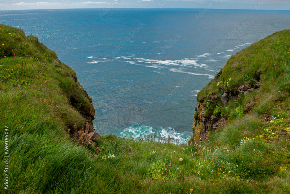 Majestic Latrabjarg cliffs in West Fjords, Iceland. Iceland attracts tourists to visit.