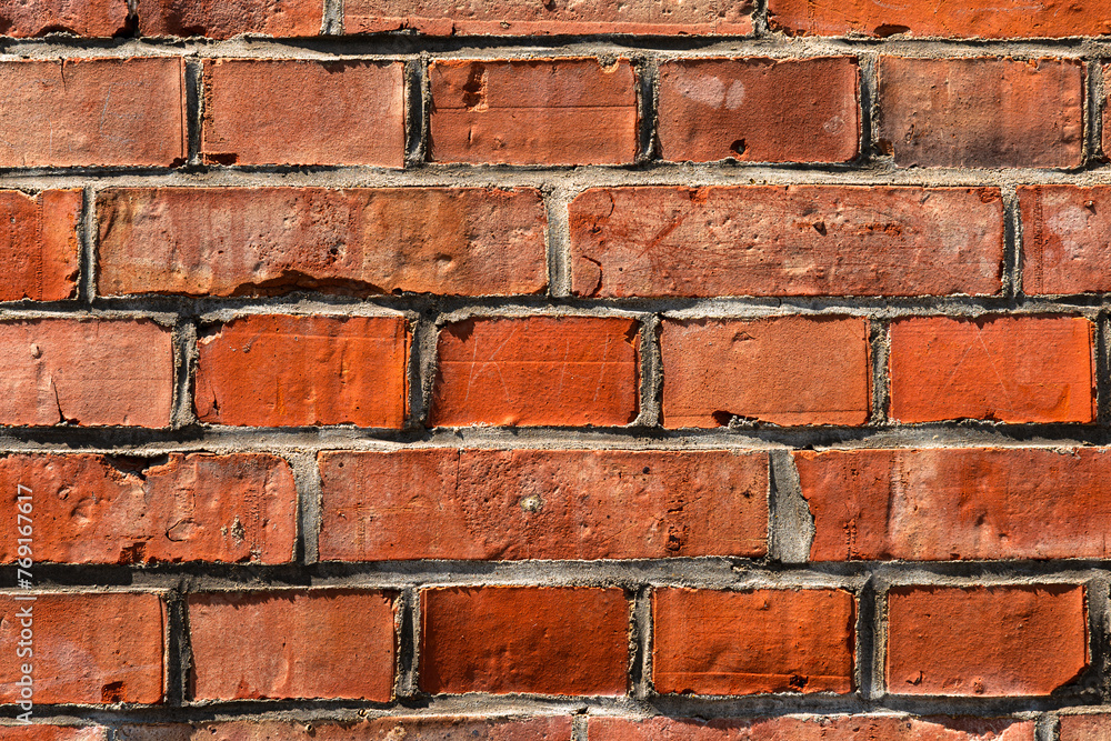 Fototapeta premium Red clay btick wall tiles seamless repeat pattern texture background.