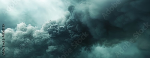 a very large cloud of smoke and steam rising from the ground in the sky