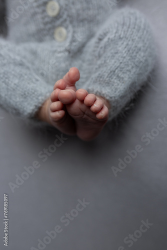 newborn baby. children's feet. newborn's legs. legs on the background. baby feet
