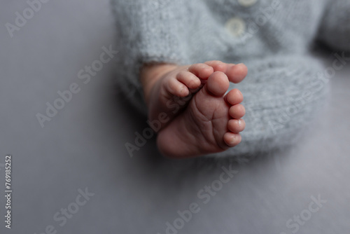 newborn baby. children's feet. newborn's legs. legs on the background. baby feet