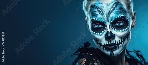 A woman with a skull painted on her face in electric blue, resembling a fictional character from an action film at an art event. The darkness adds a touch of fiction
