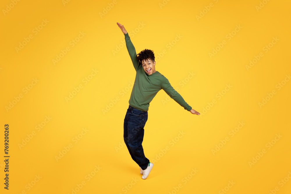 Man in mid-jump with arms outstretched