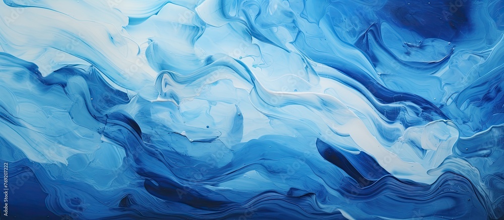 A detailed view of an artwork depicting a mixture of blue and white paint strokes, creating an abstract and vibrant composition.