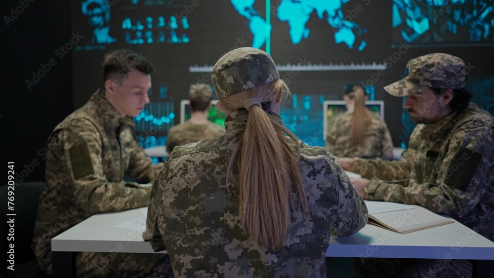 Group of security squad in control center. Military headquarters surveillance officers cyber police briefing at the table in office, checking paper documents.