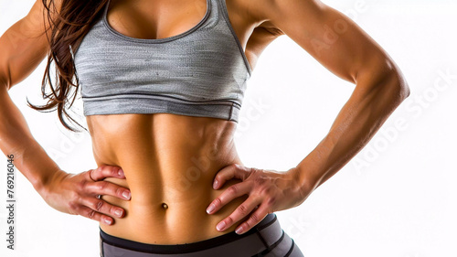 Abdominal shot of an attractive slim healthy young woman witrh fab abbs wearing a sports bra and belly boutton stud against a white background health fitness and wellbeing concept photo