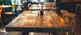 Wooden table in a cafe and restaurant setting.
