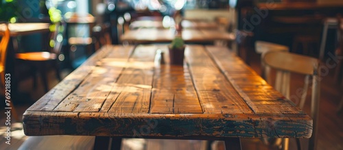 Wooden table in a cafe and restaurant setting. © Vusal