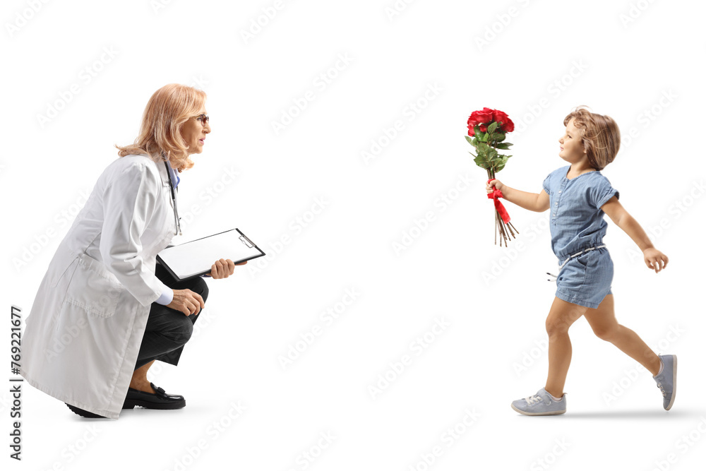 Little girl with a bunch of flowers running towards a female doctor Little girl with a bunch of flowers running towards a female doctor