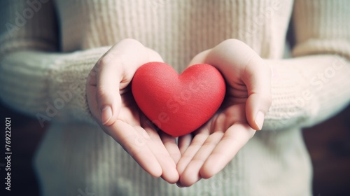 Close-up of woman's hands adorned with elegant Valentine's Day-inspired neutral colors and red hearts, Ai Generated