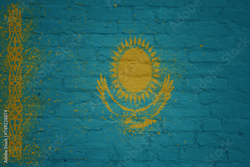 colorful painted big national flag of kazakhstan on a massive brick wall