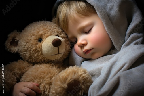 A young child peacefully sleeps next to a soft teddy bear, wrapped in a warm blanket. Generative AI