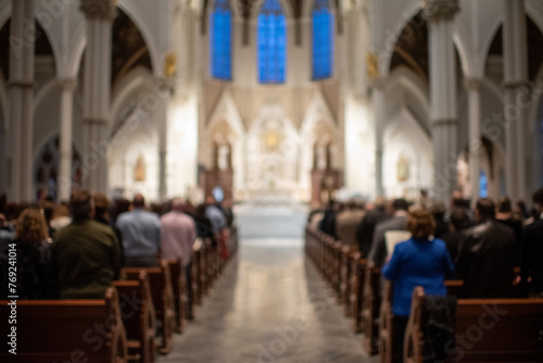 Blurry congregation in cathedral during Catholic Mass